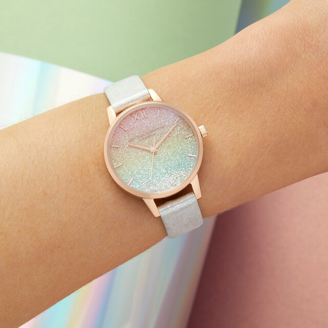 Montre motif arc-en-ciel demi cadran perle et or rose